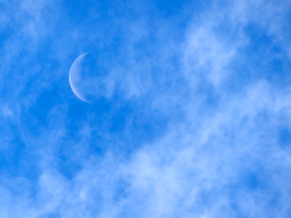 Crescent Moon in Blue Sky with Clouds