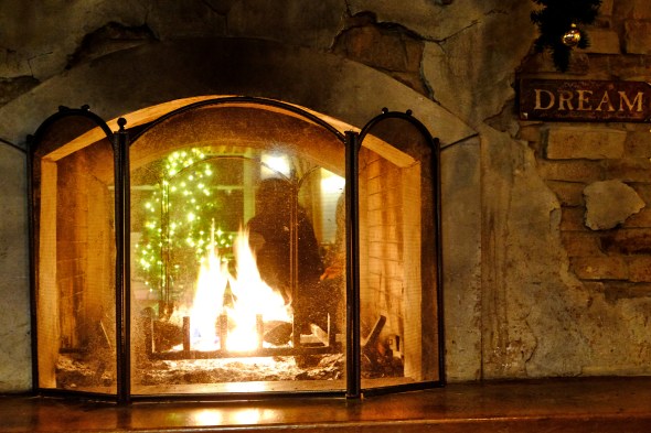 Fire in Fireplace with "Dream" Sign on Hearth