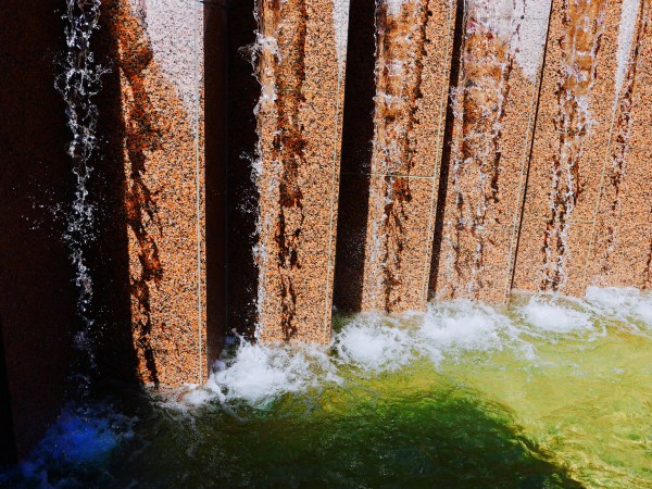 Fountain with streams of water flowing over marble