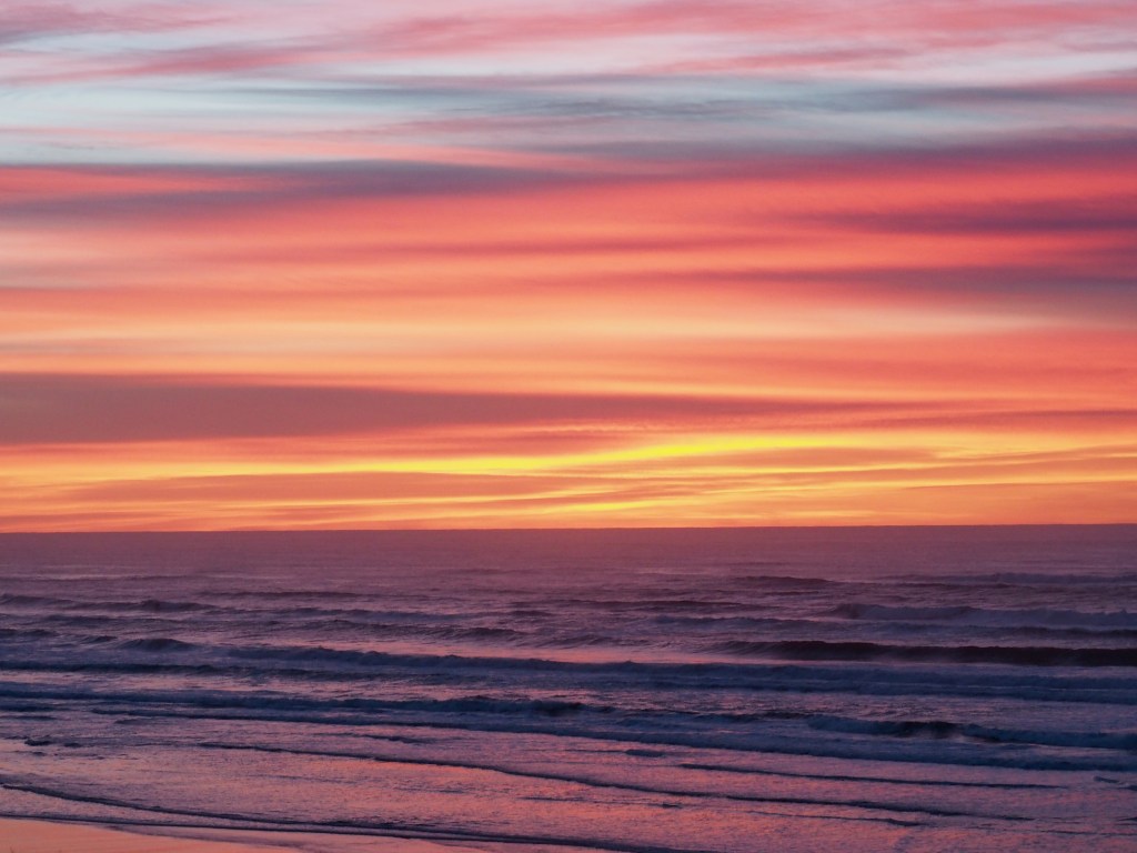 Pastel-colored ocean surf and sky
