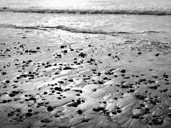 Beach with stones and surf