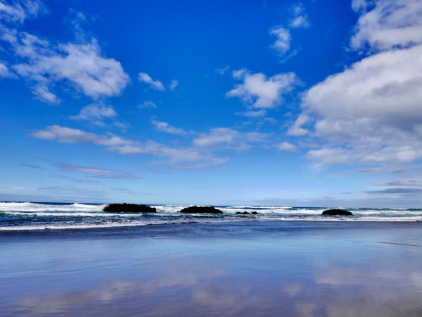 Pacific beach, surf and blue sky
