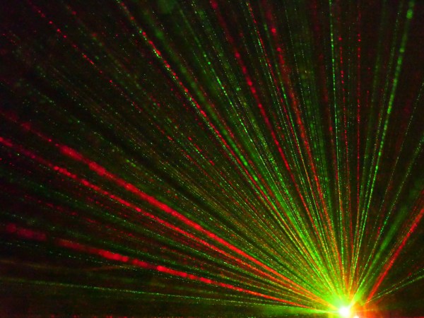 Red and green shafts of light in darkness