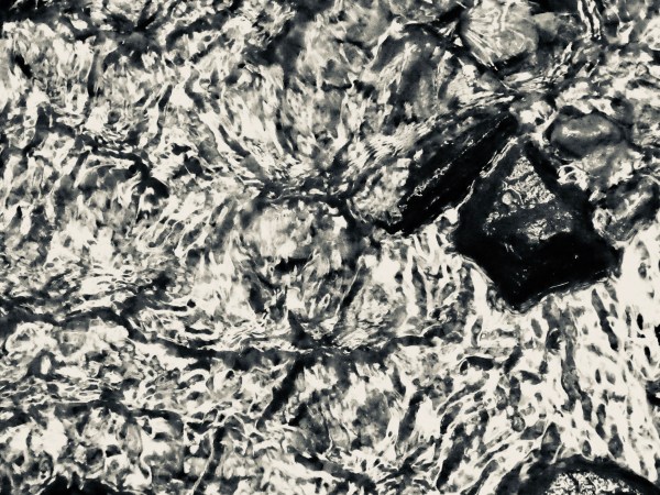 Abstract pebbles in silver stream