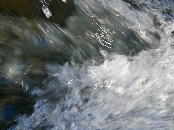 Close-up of whitewater rushing in creek