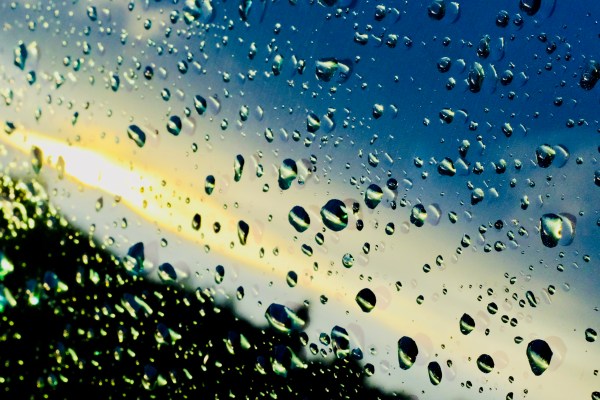 raindrops and reflections on car window