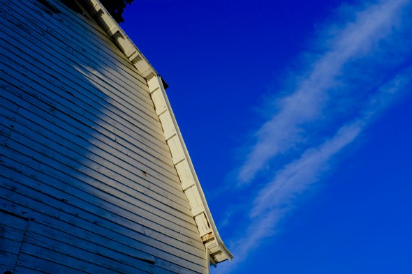 White barn and blue sky