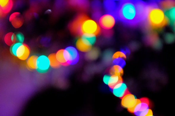 colorful holiday lights shining in darkness