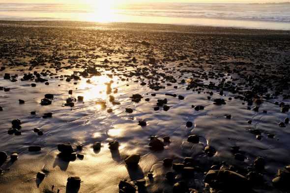 Sandy beach, rocks and surf