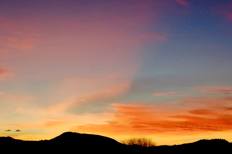 Orange sky over mountains after sunset