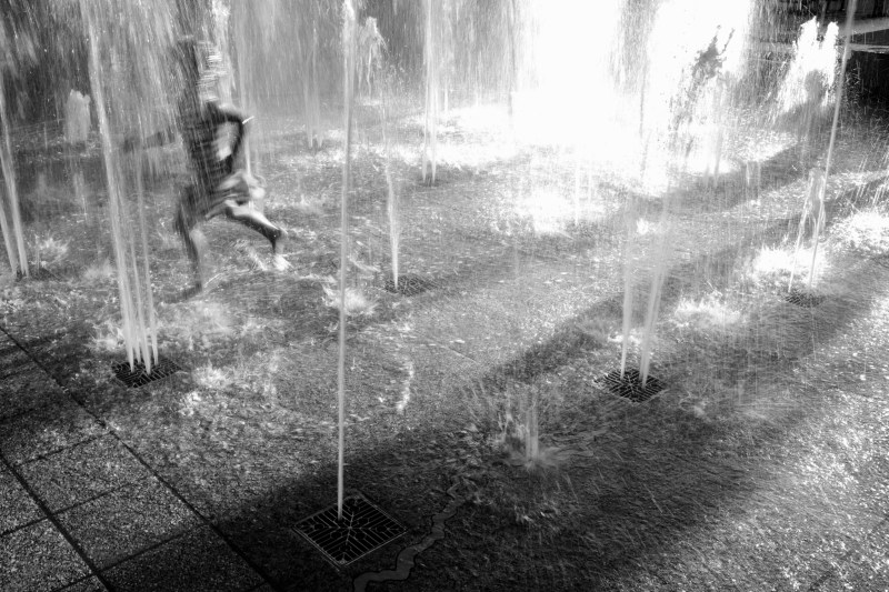children playing in fountain