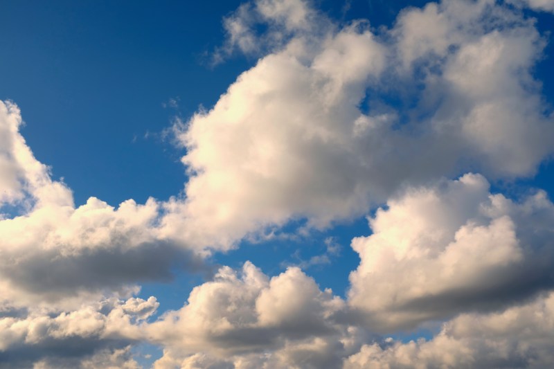 blue sky with puffy white clouds