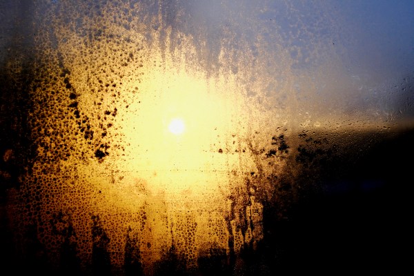 rising sun through window