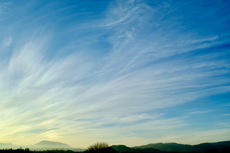 high, feathery clouds and blue sky over Oregon Coast Range