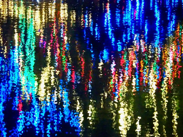 holiday lights reflected in pond