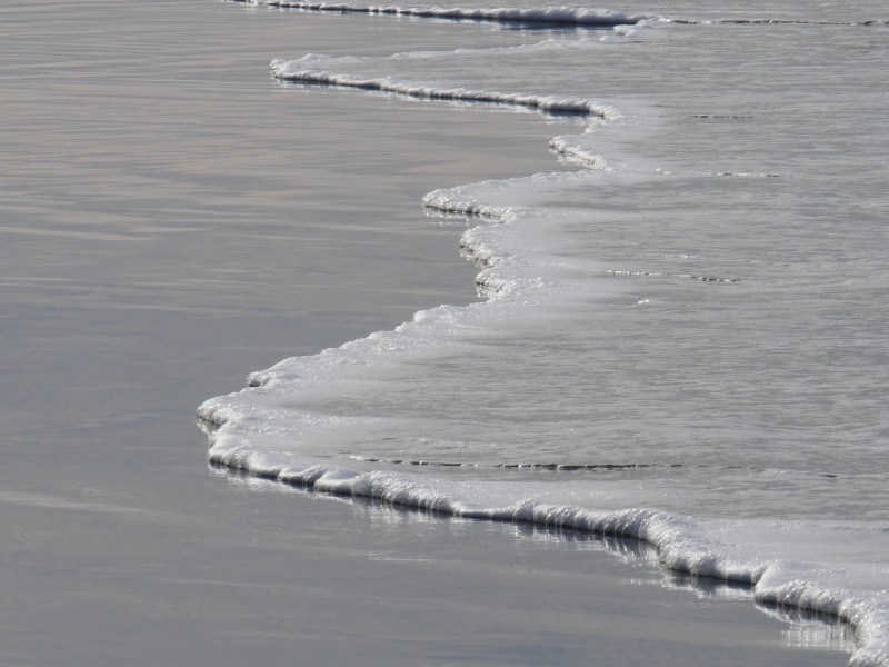 water lapping up on ocean beach
