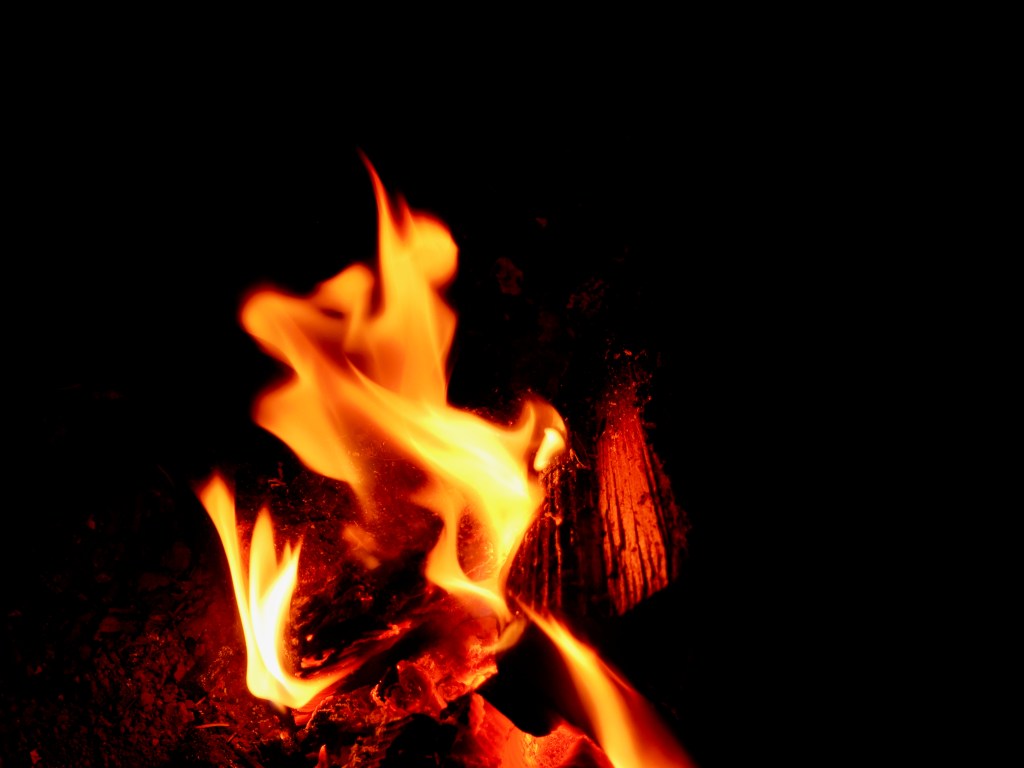 campfire at night with orange flames