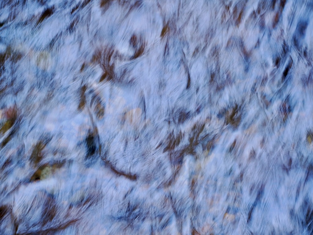 silky slow-motion photo of whitewater in creek