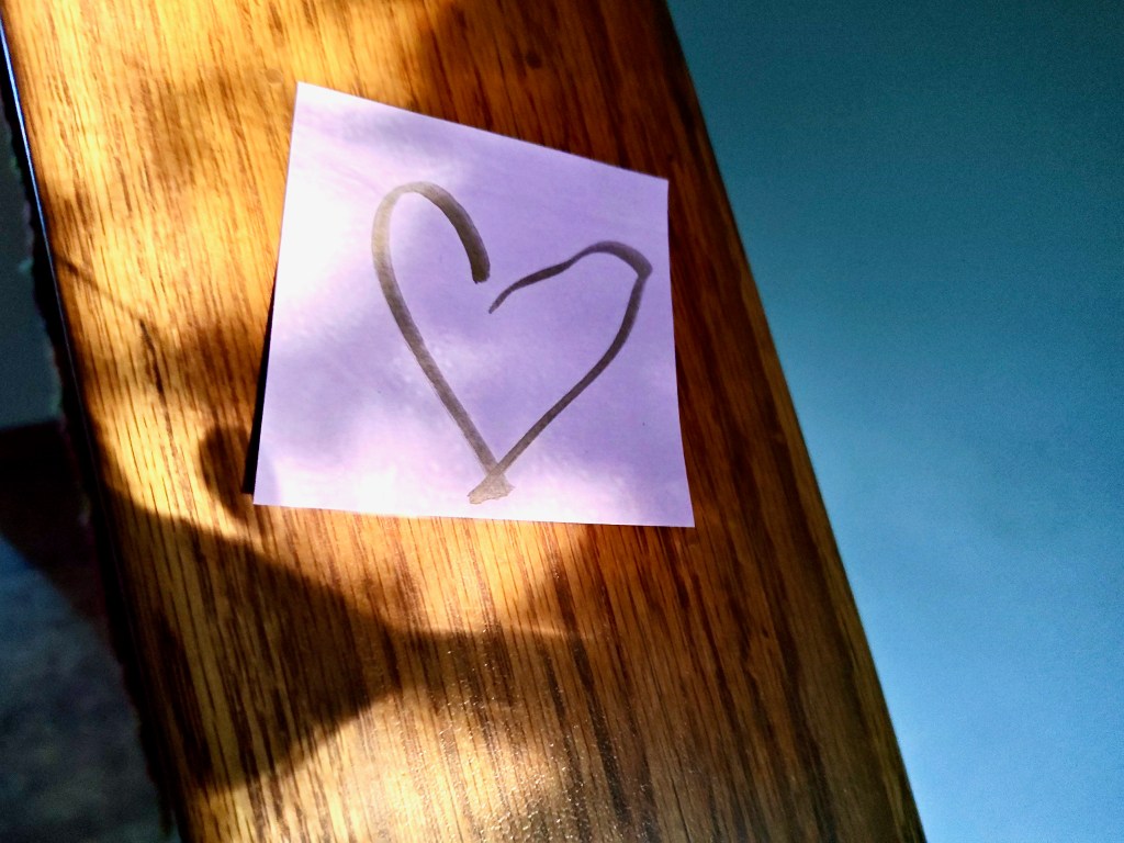 heart drawn on post-it note