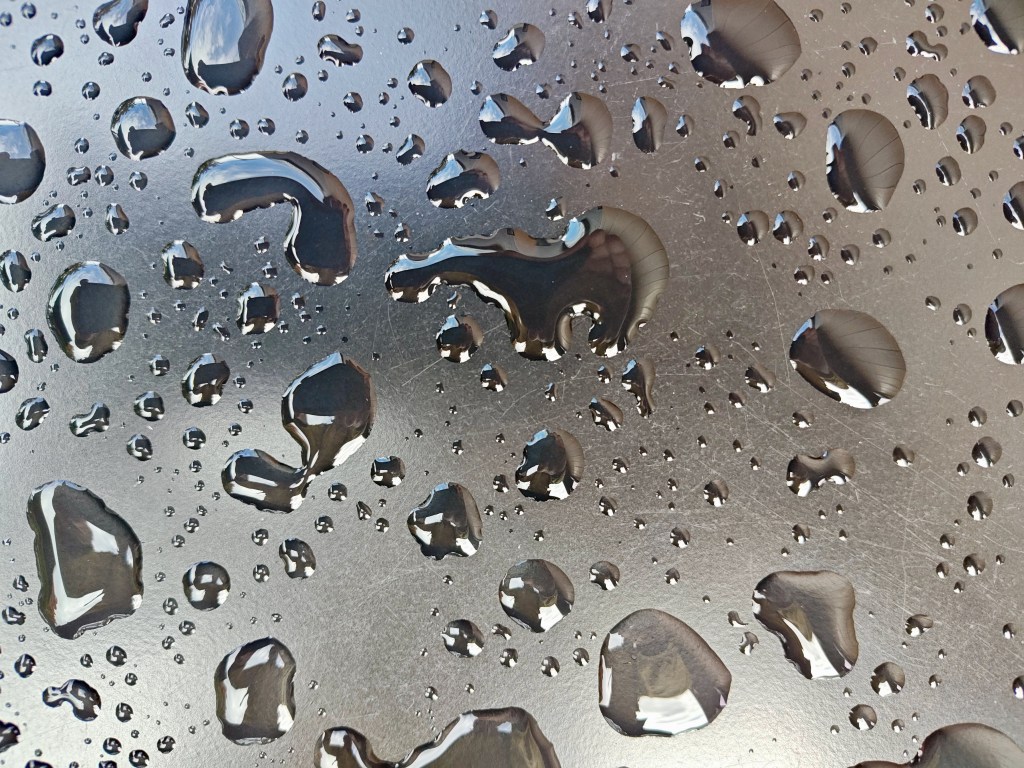raindrops on silver tabletop